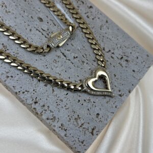 14K YELLOW TONE MIAMI CUBAN CHAIN WITH A HEART PENDANT IN THE MIDDLE