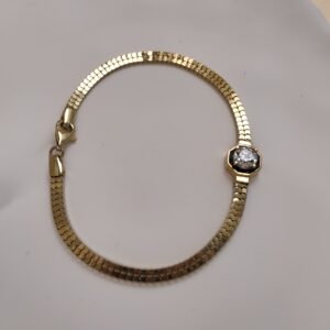 14K YELLOW GOLD OMEGA WITH A SINGLE DIAMOND ACCENT